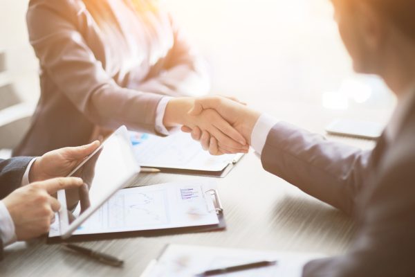 Business people shaking hands, finishing up a meeting